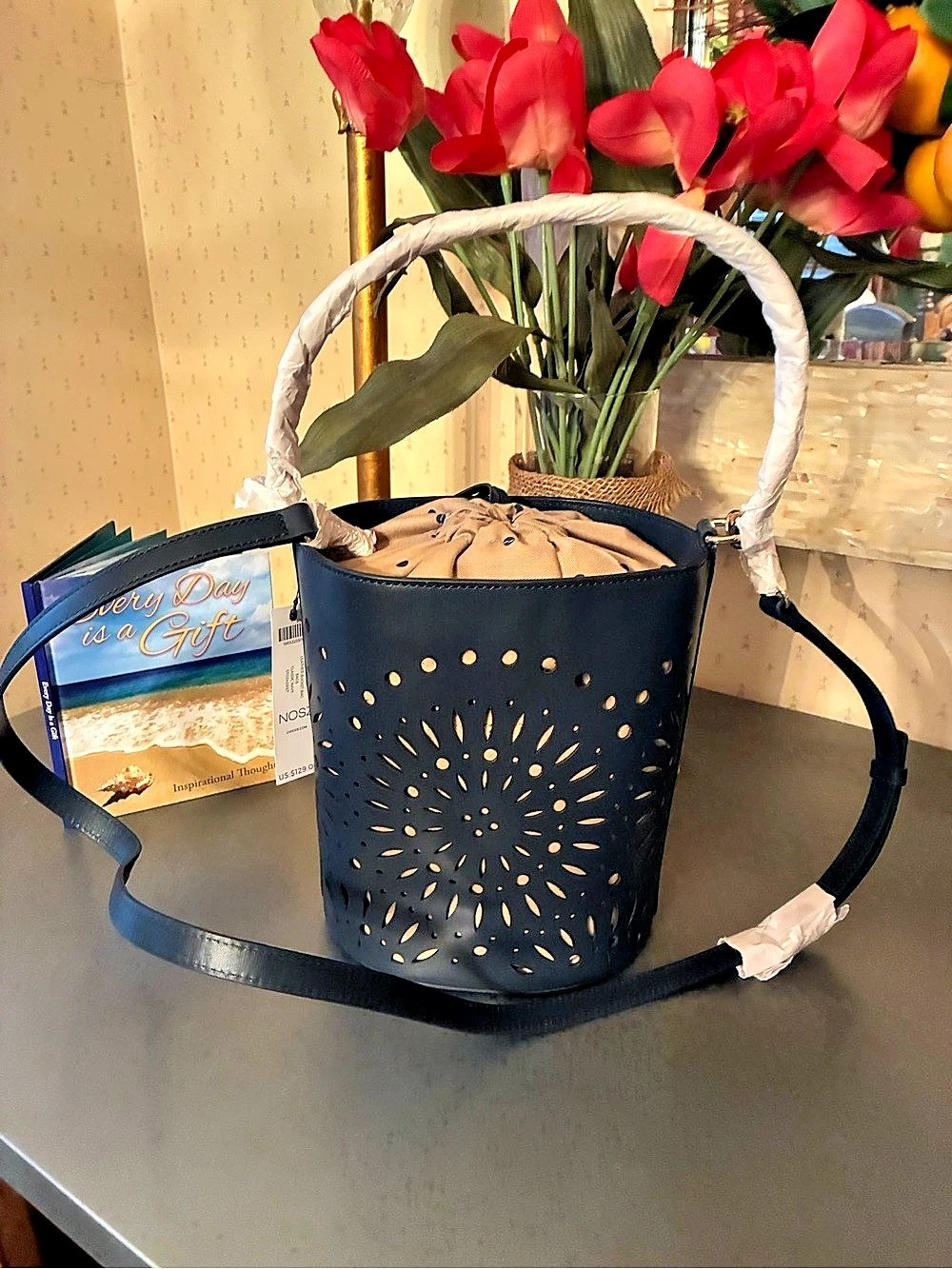 Chico, NEW WITH TAGS, CLASSIC NAVY BLUE Oval laser cut LEATHER bucket bag.